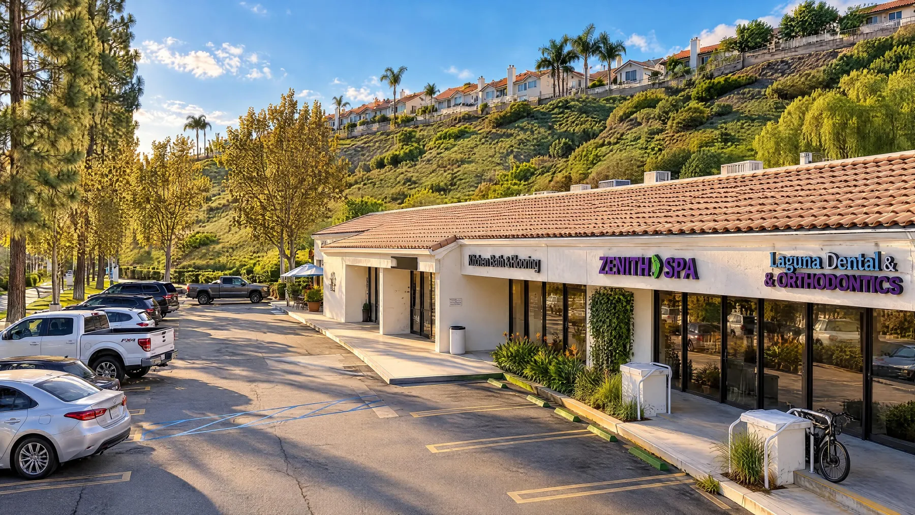Eye-level view of the north end of the shop building with Zenith Spa and Laguna Dental & Orthodontics